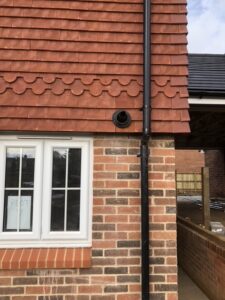 A new black PVC downpipe installed on a house in Gosport.