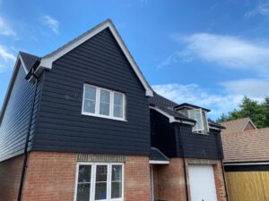 New grey composite cladding installed on a new build house in Gosport.