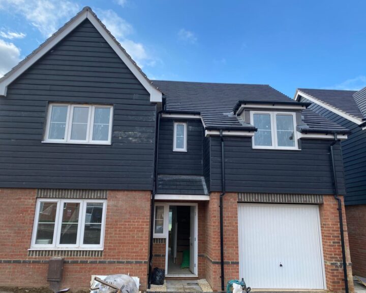 New grey composite cladding installed on a new build house in Gosport.